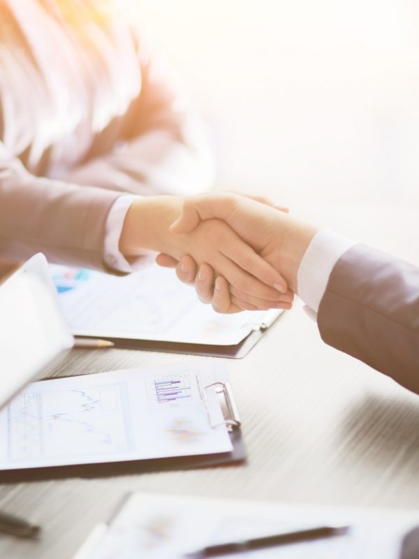 Business people shaking hands, finishing up a meeting